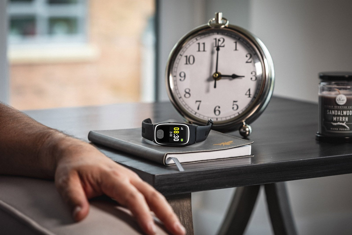 Personal alarm watch on desk
