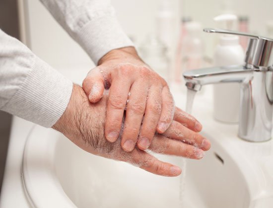 Elderly person washing hands